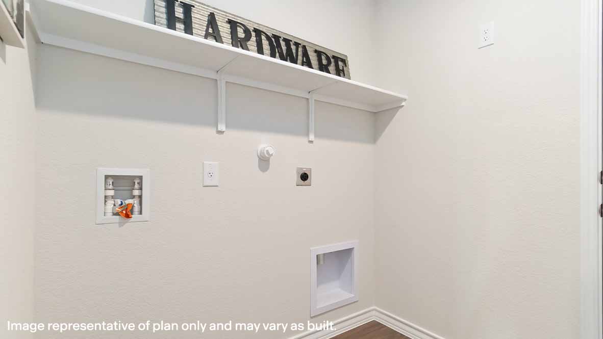 spacious utility room with shelving