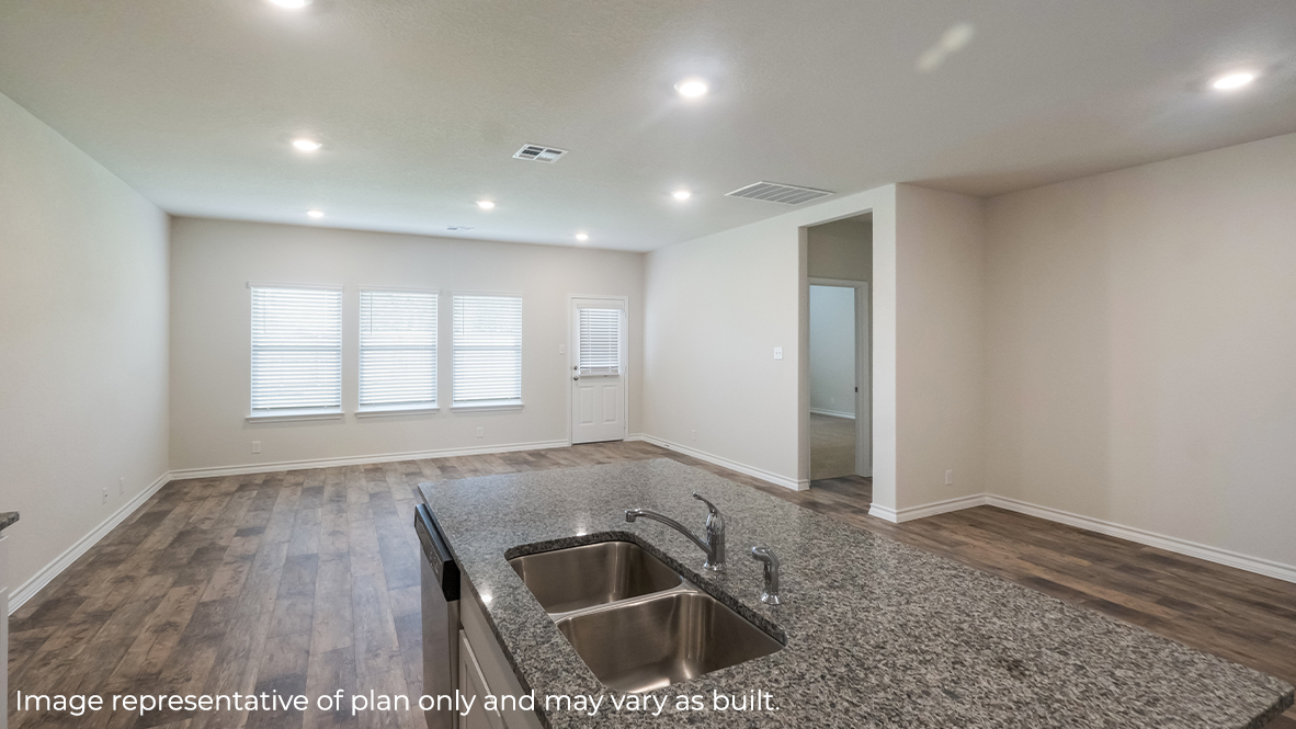 kitchen island overlooking blended living room and dining area