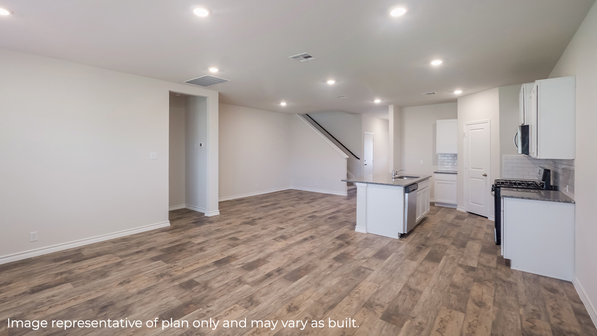 open concept living room flowing into kitchen and dining area