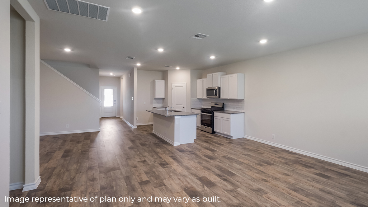 open concept living room flowing into kitchen and dining area