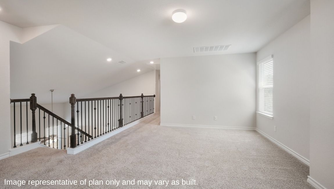Loft or game room with quality carpet flooring and large windows providing natural light.