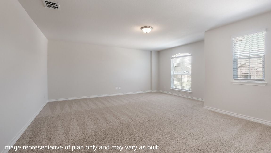 spacious upstairs loft with carpet and large windows