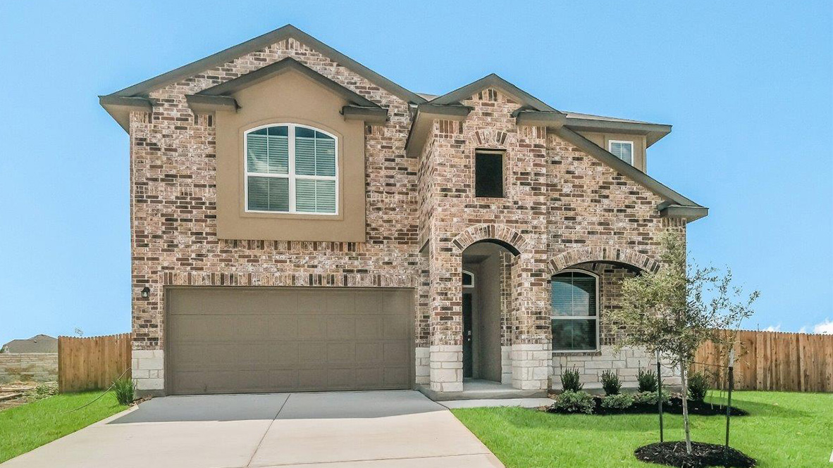exterior of the clydesdale plan with brick stone and stucco front exterior and 2 car garage