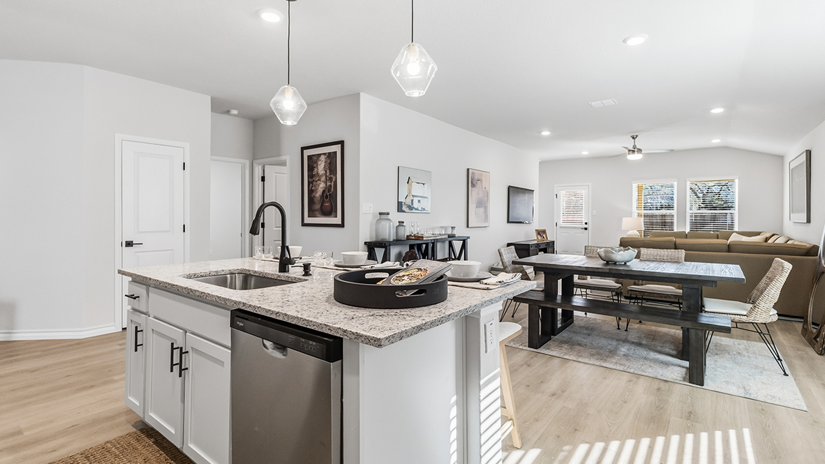 large kitchen island overlooking open concept dining and living area