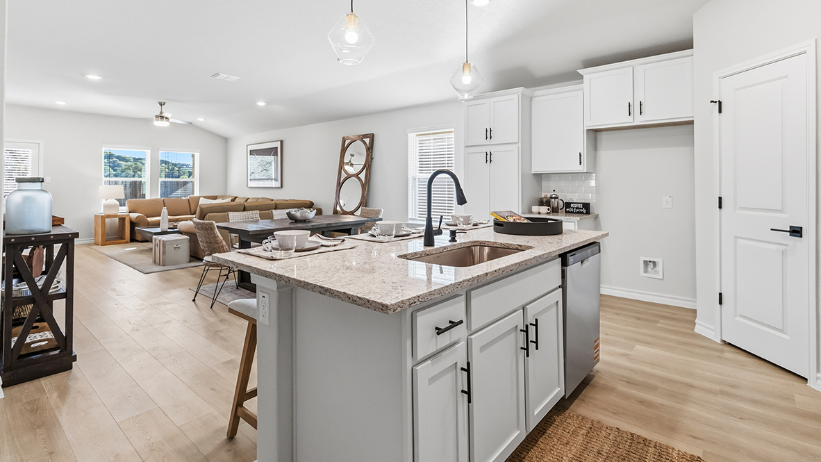 large kitchen island overlooking open concept dining and living area