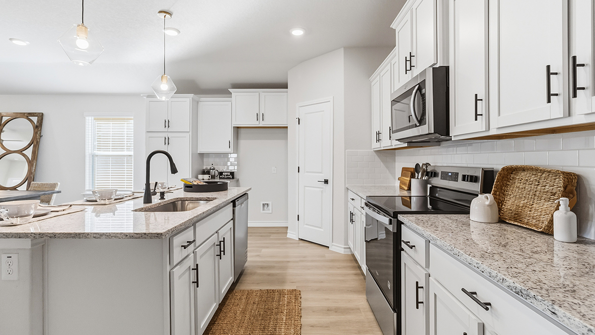kitchen with quartz or granite countertops and stainless steel appliances