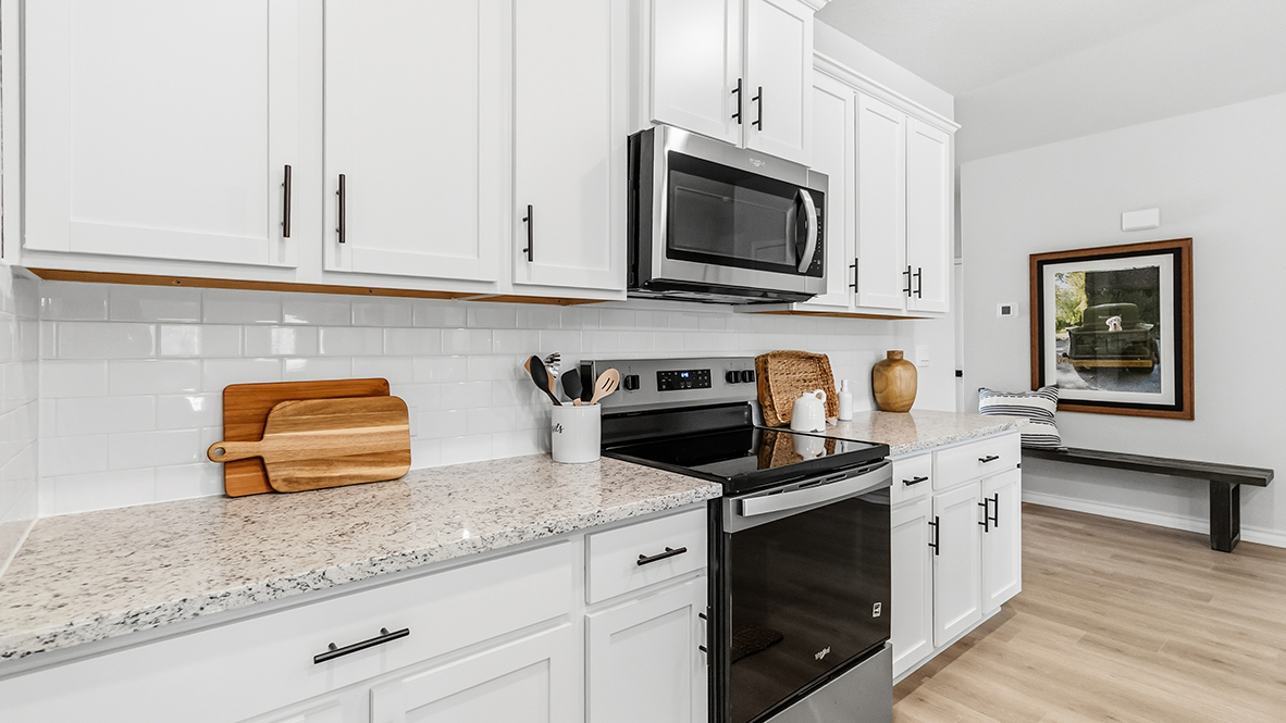 kitchen with stainless steel appliances and subway tile backsplash