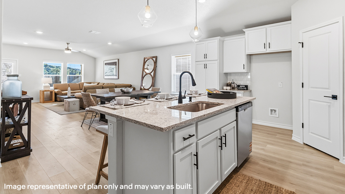 kitchen island overlooking open concept dining area and living area