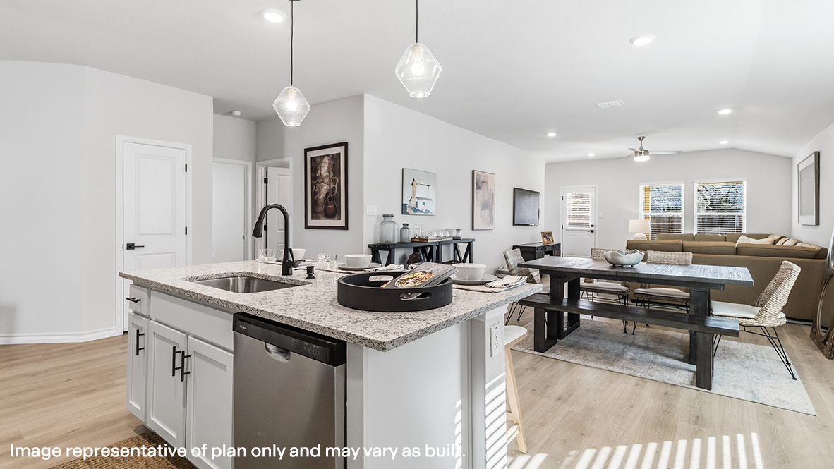 kitchen island overlooking open concept dining area and living area
