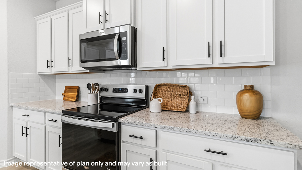 kitchen with stainless steel appliances and subjway tile backsplash