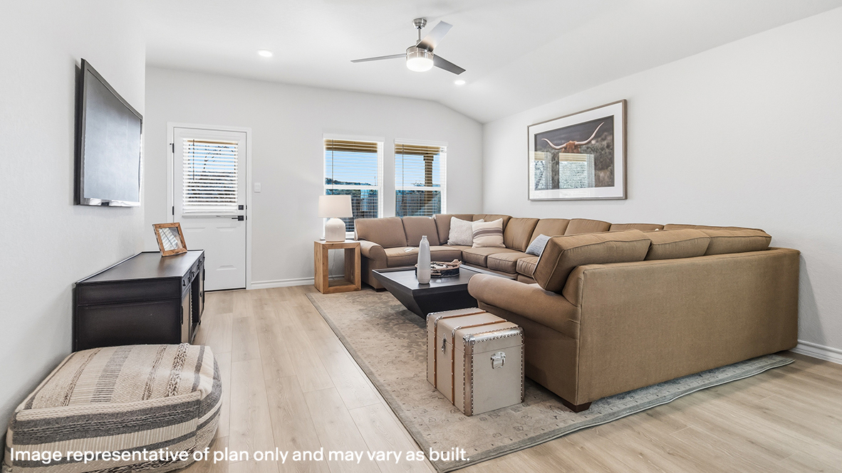 living room with large windows, ceiling fan and hard surface flooring