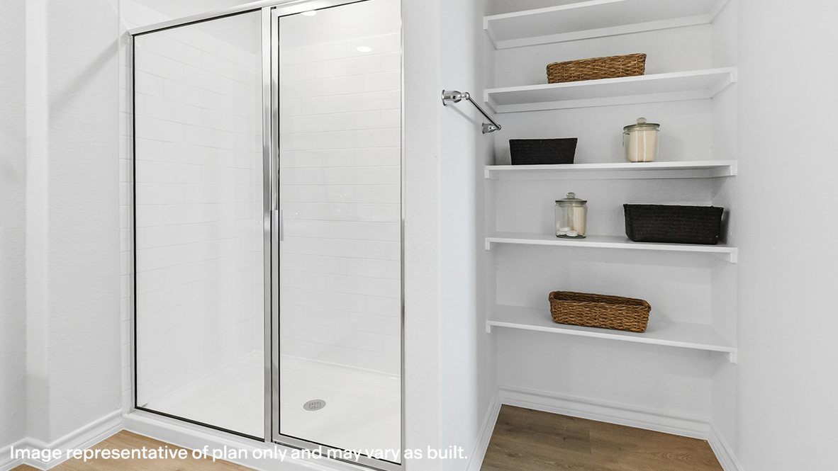 ensuite bathroom with walk in shower and built in shelving