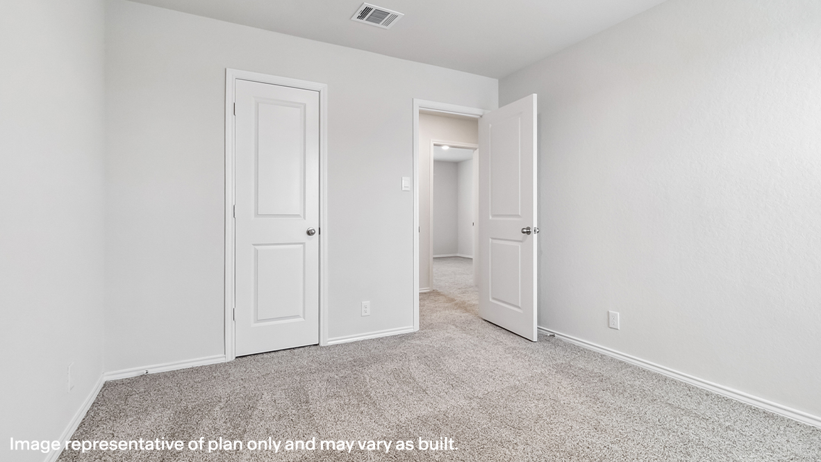 Secondary bedroom closet with shelving.