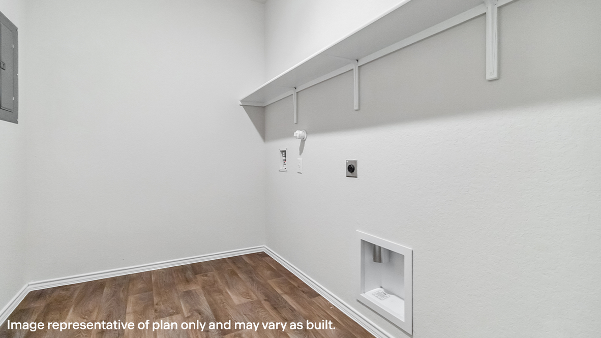 Spacious utility room with shelving.