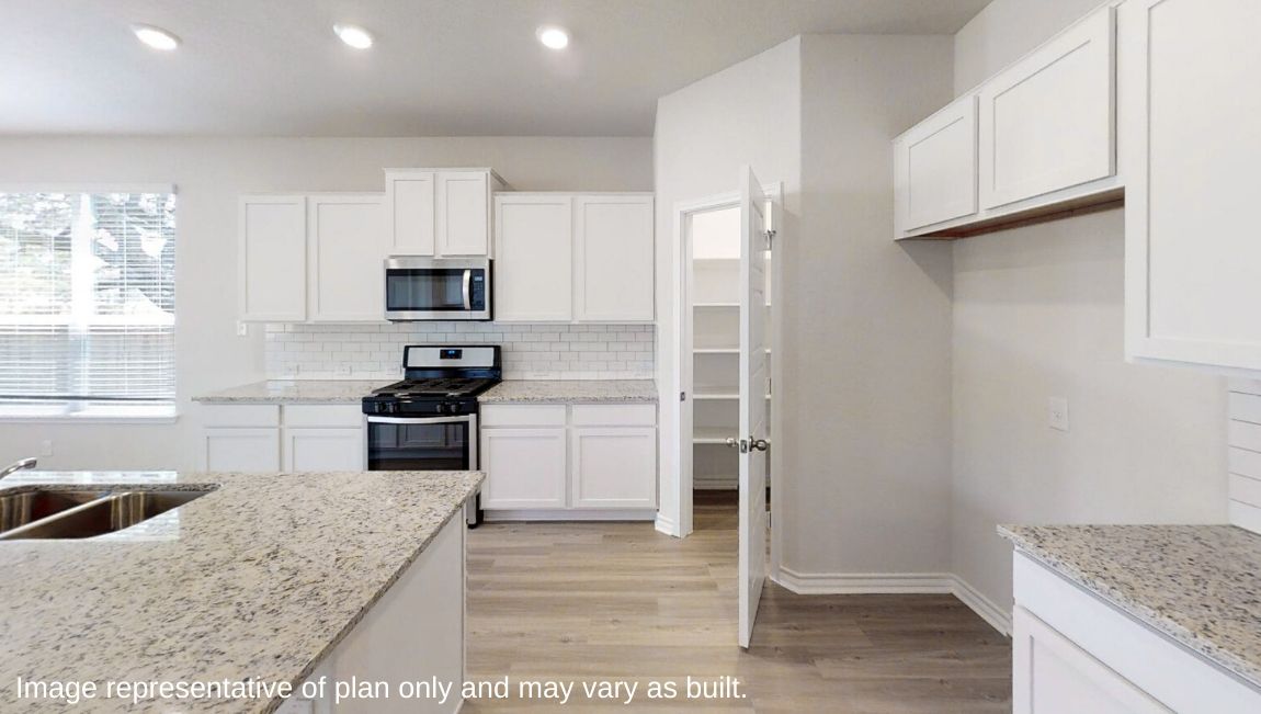 open concept kitchen with hard surface flooring and plenty of counterspace