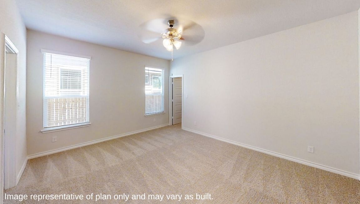primary bedroom with quality carpet