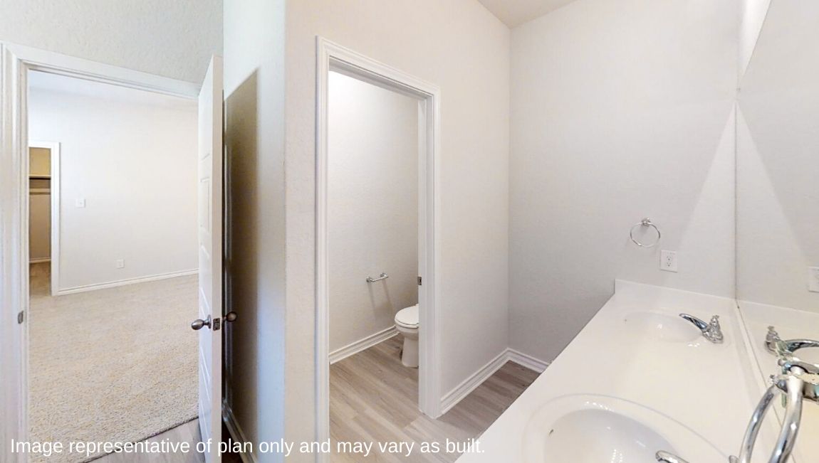 primary bathroom with double vanity sink