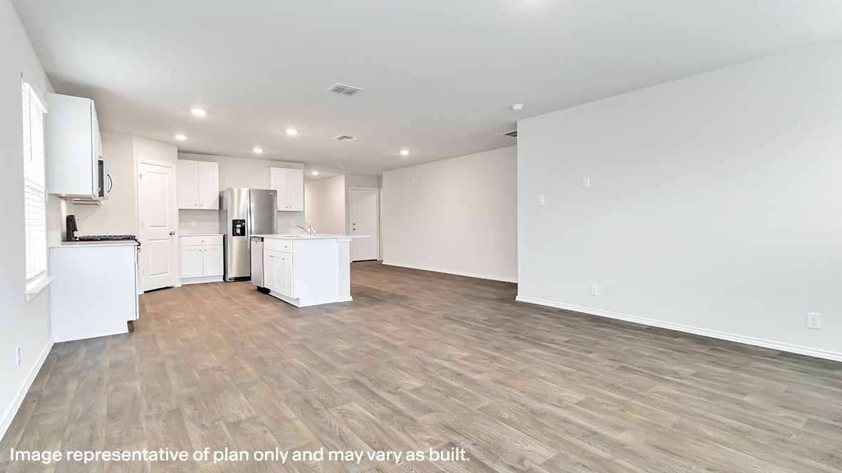 open concept living area with hard surface flooring and window
