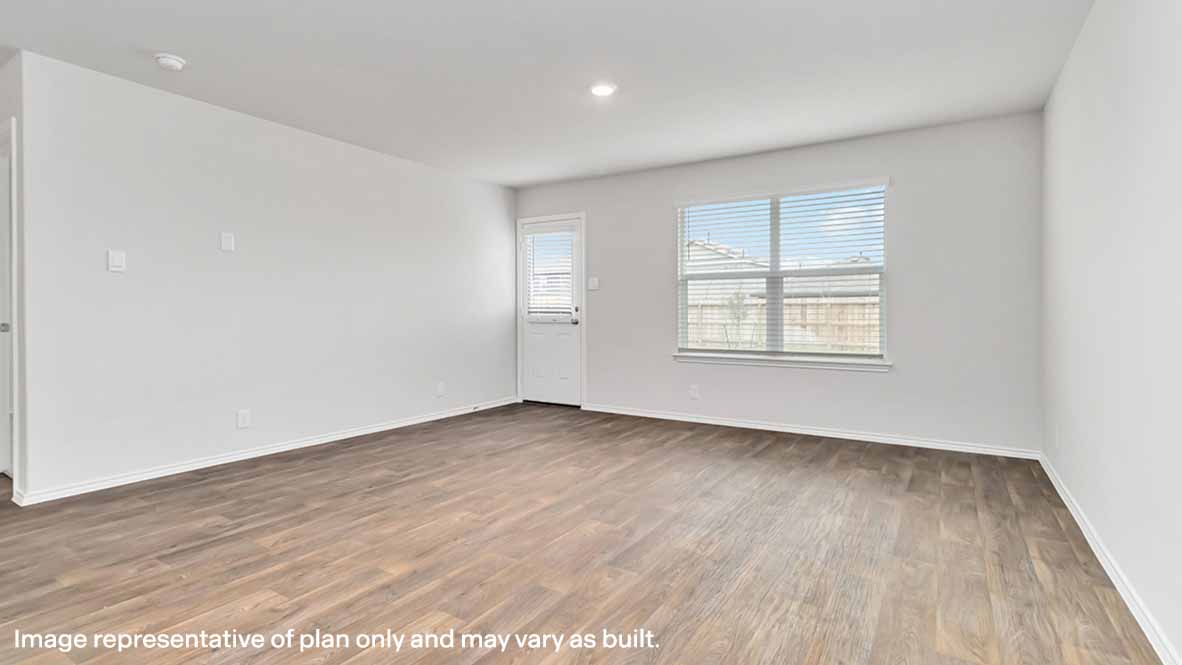 spacious living area with hard surface flooring, patio door and window