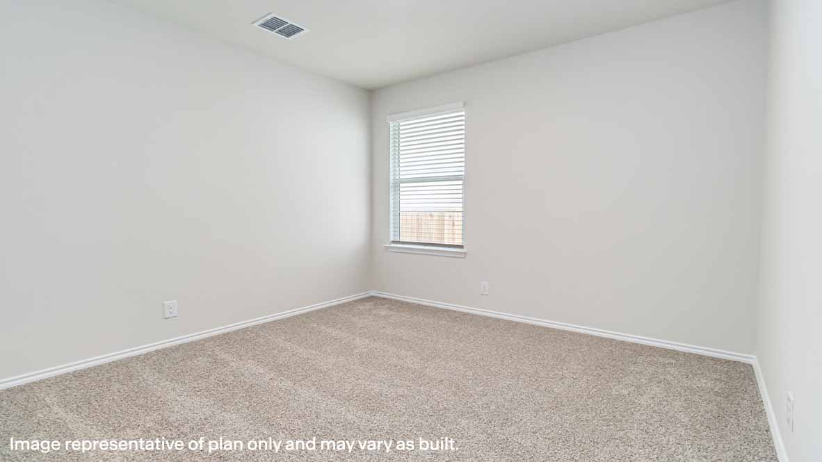 spacious secondary bedroom with quality carpet and window