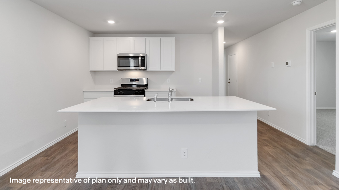 kitchen with shaker style cabinets, stainless steel appliances and large kitchen island.