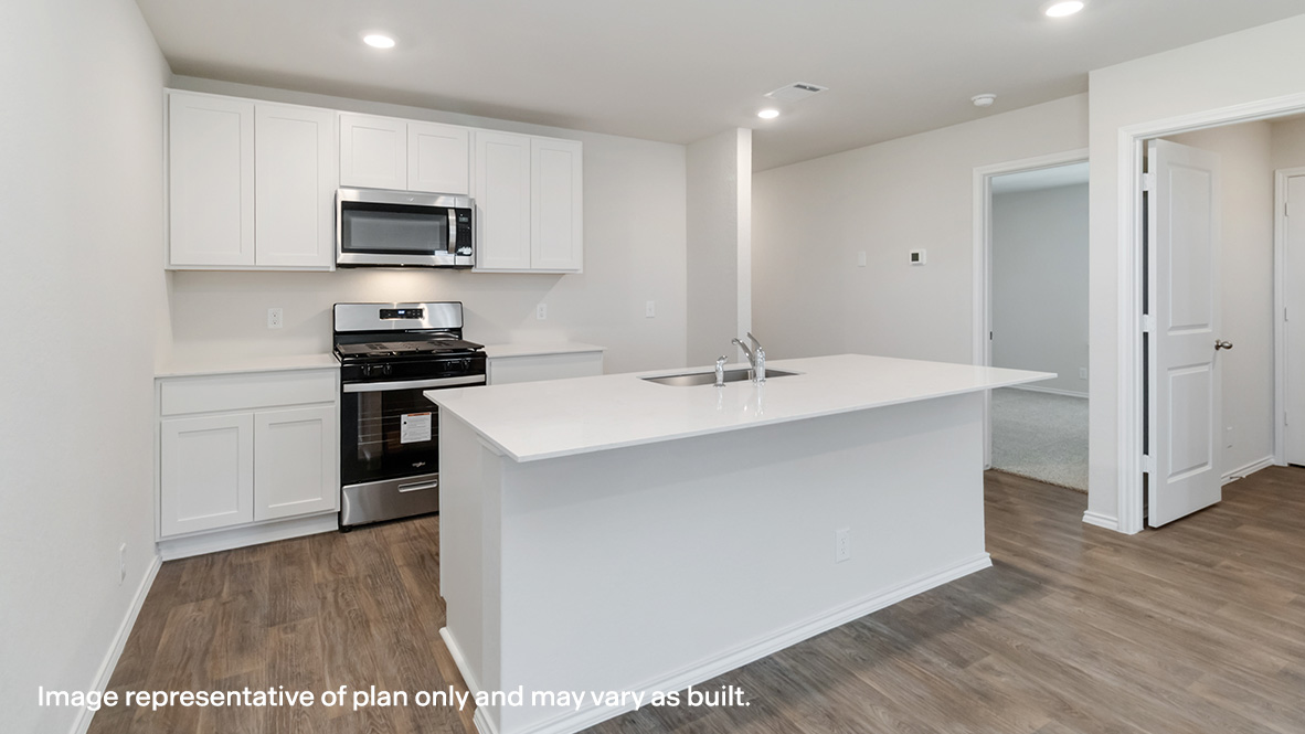 kitchen with shaker style cabinets, stainless steel appliances and large kitchen island.