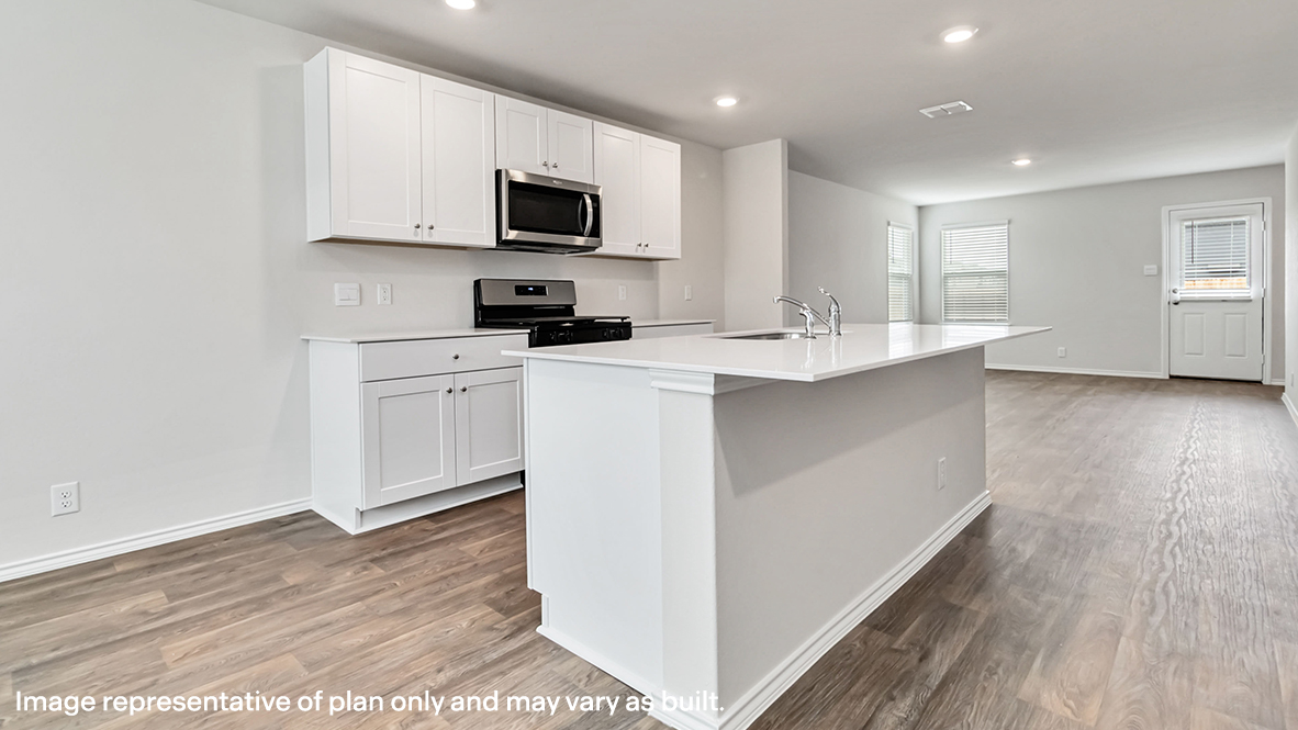 kitchen with large kitchen island located between dining area and living room