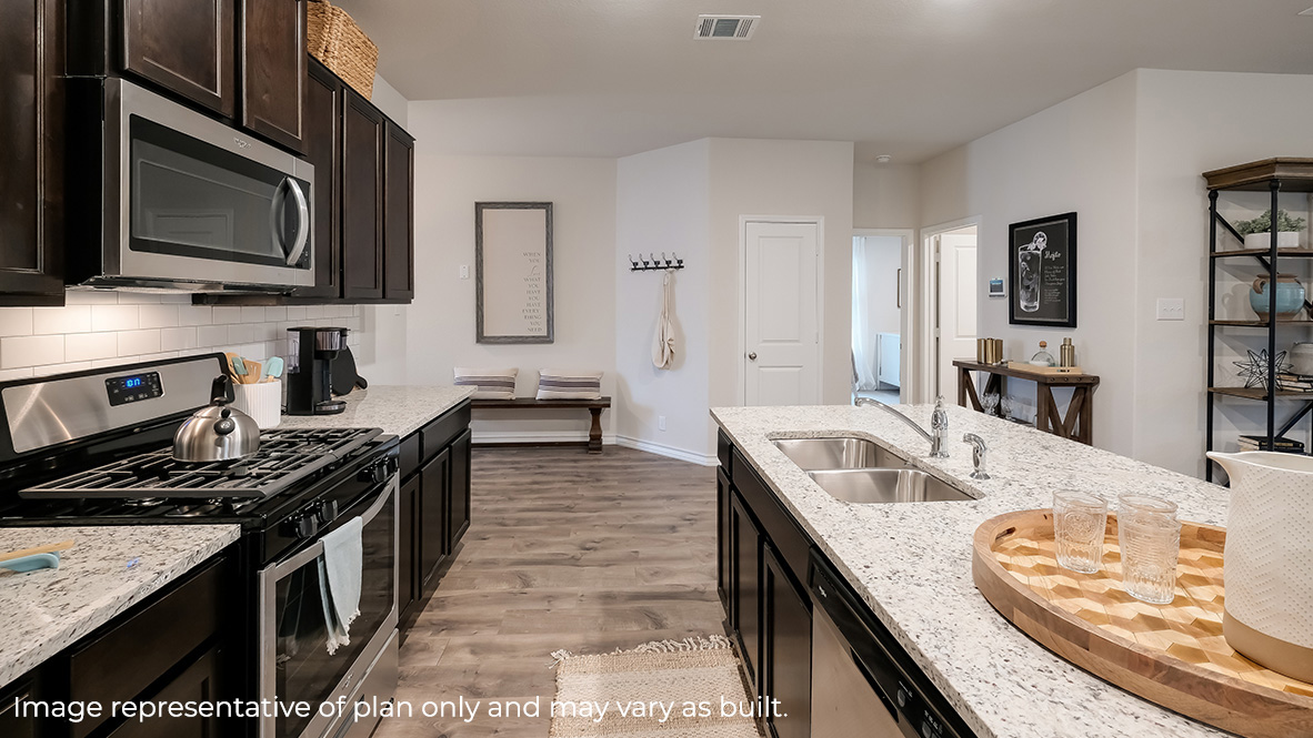 kitchen with stylish quartz or granite countertops, stainless steel appliances and spacious kitchen island.