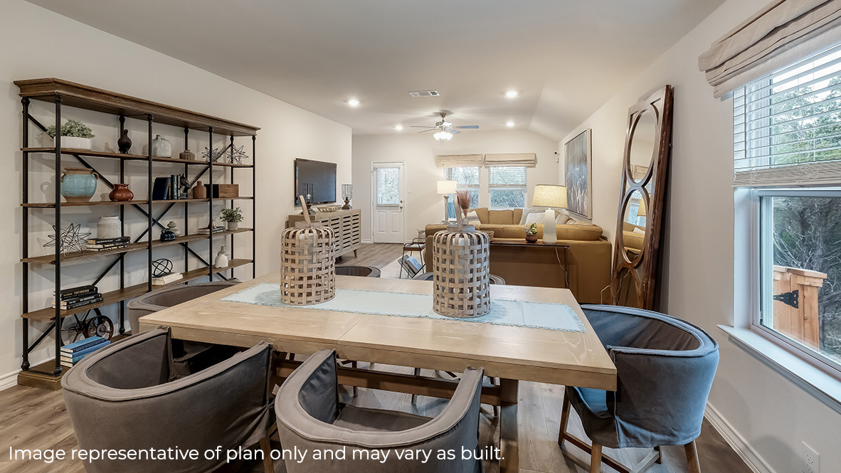 blended dining area flowing into living room with large windows for plenty of natural lighting.