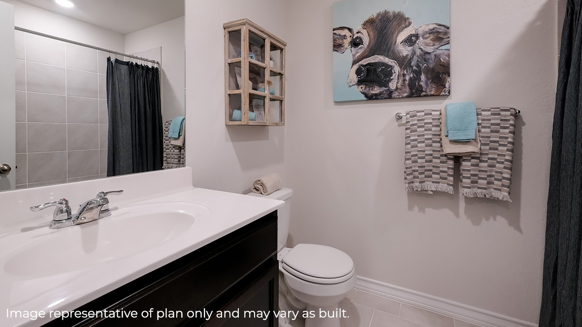 second full bathroom with single vanity sink, toilet and combined tub and shower.