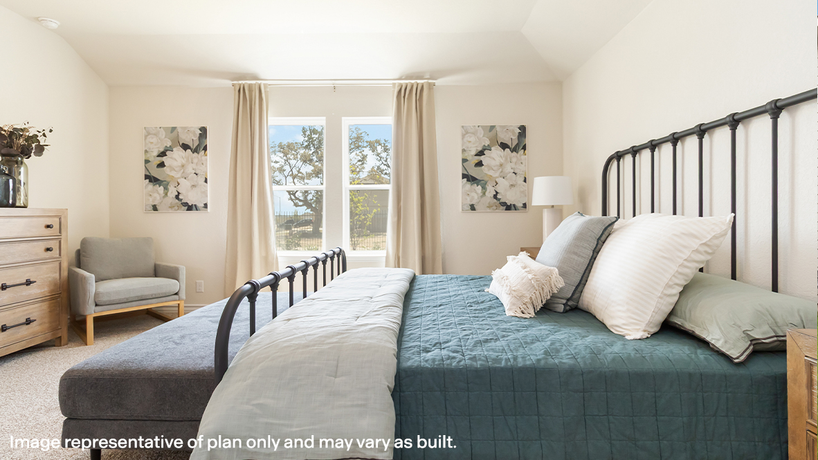 spacious primary bedroom with large windows and quality carpet