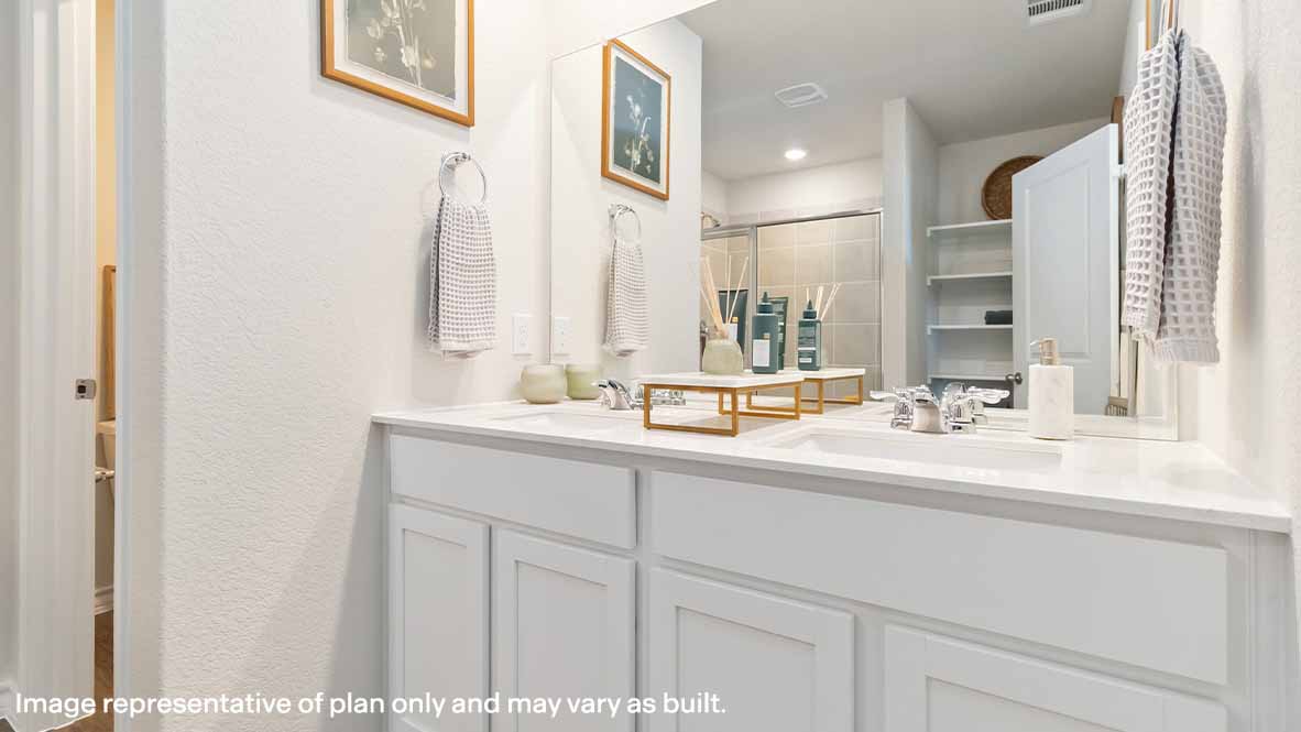 spacious primary bathroom with double vanity sink