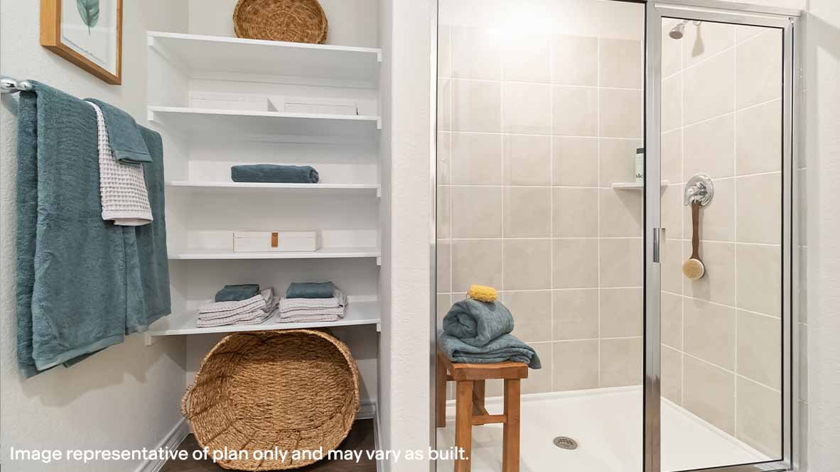 primary bathroom luxury walk in shower and built in shelving