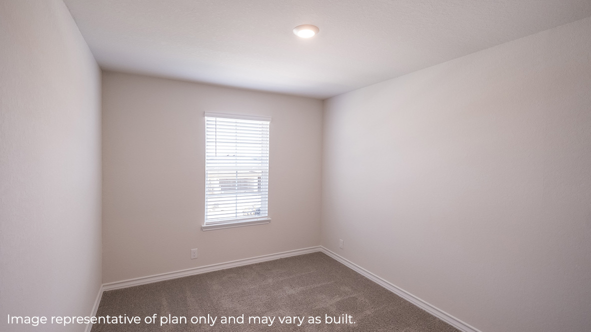 Bedroom with a window and overhead lighting