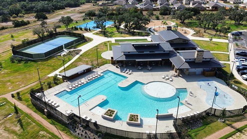 Ariel view of amenity pool and courts