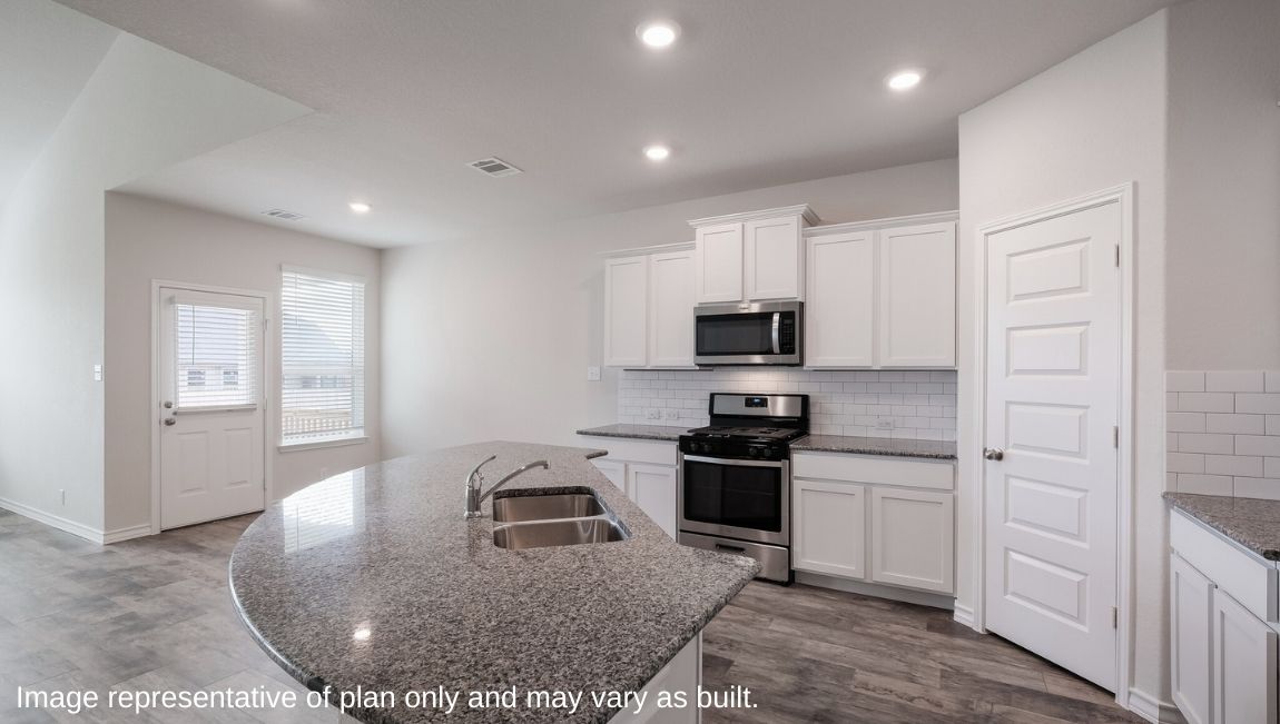 Side view of kitchen with pantry, cabinets, dining and living areas Brookstone Creek