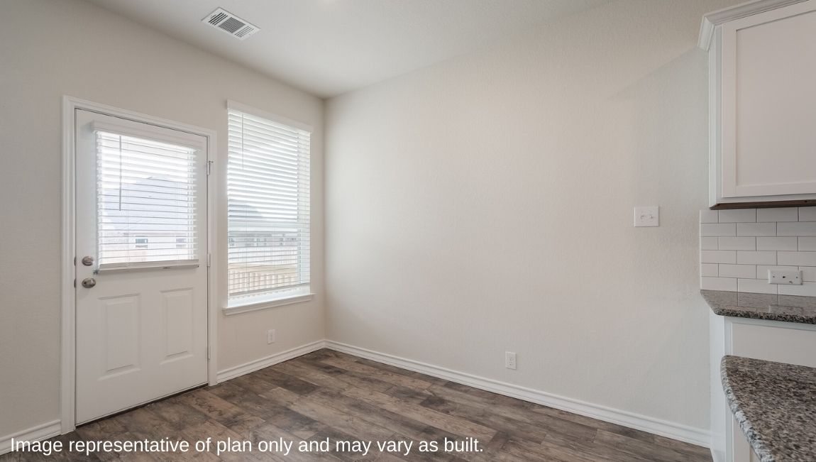 Dining room with natural light, open access and seamless flow continuing to backyard access Brookstone Creek