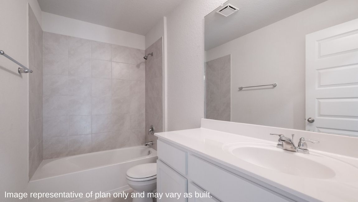 Family full bathroom with stylish vanity, mirror, polished fixtures, cabinets, tub-shower combo Brookstone Creek