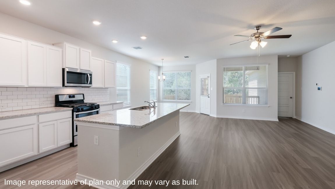 blended kitchen, living room and dining area
