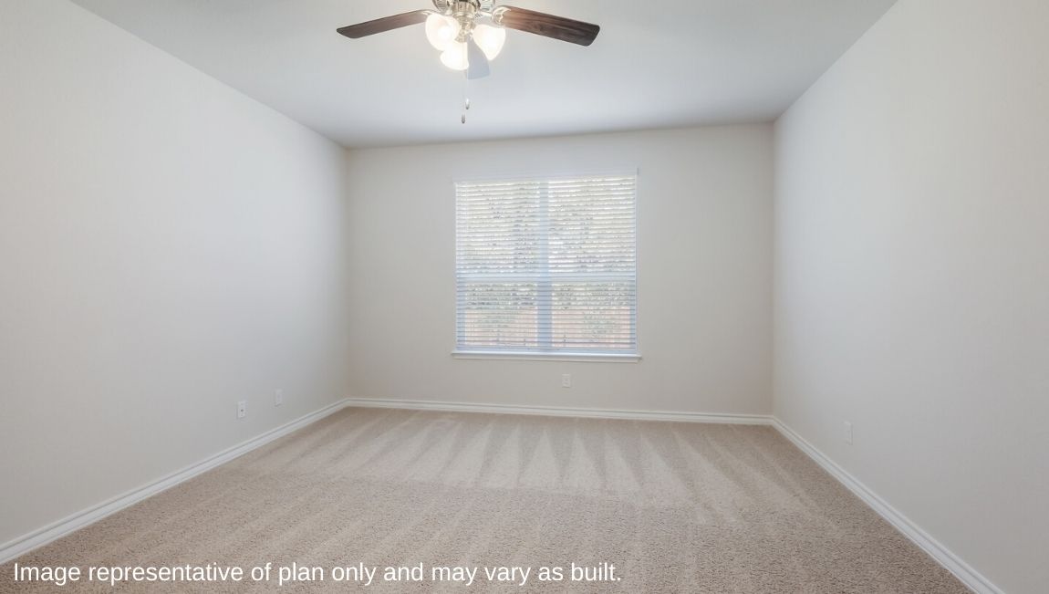 main bedroom suite with carpet, windows and ceiling fan
