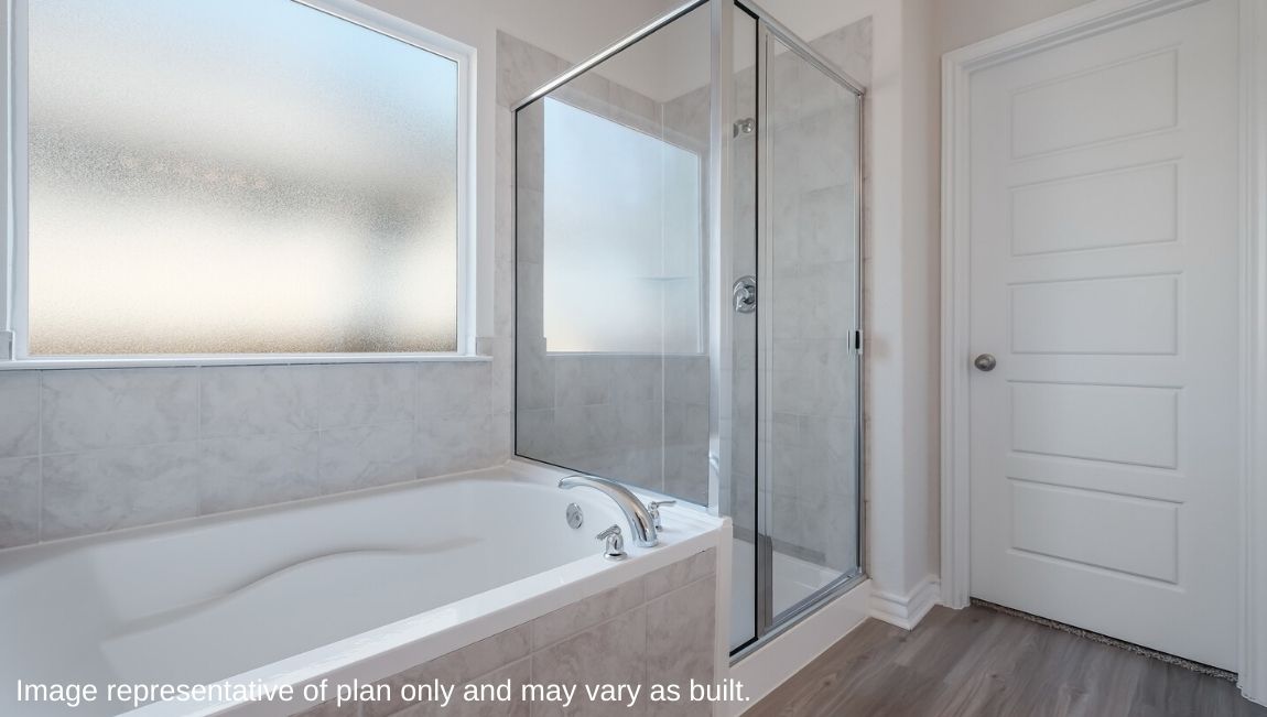 main ensuite bathroom with separate garden tub and large walk in shower