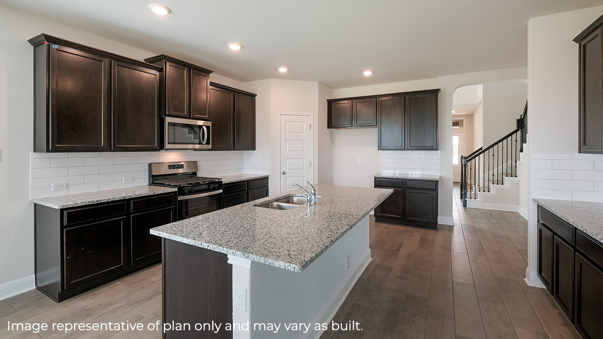 kitchen with plenty of cabinets, spacious kitchen island and stainless steel appliancess