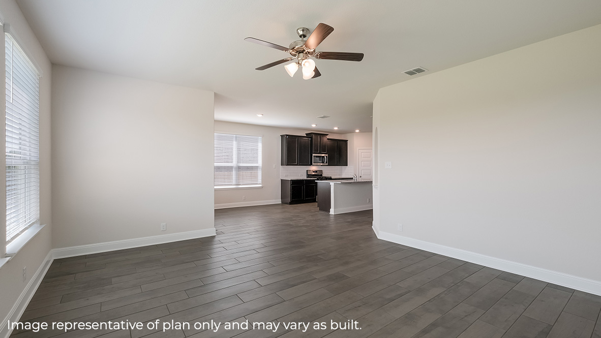 open concept living room flowing into breakfast nook and kitchen