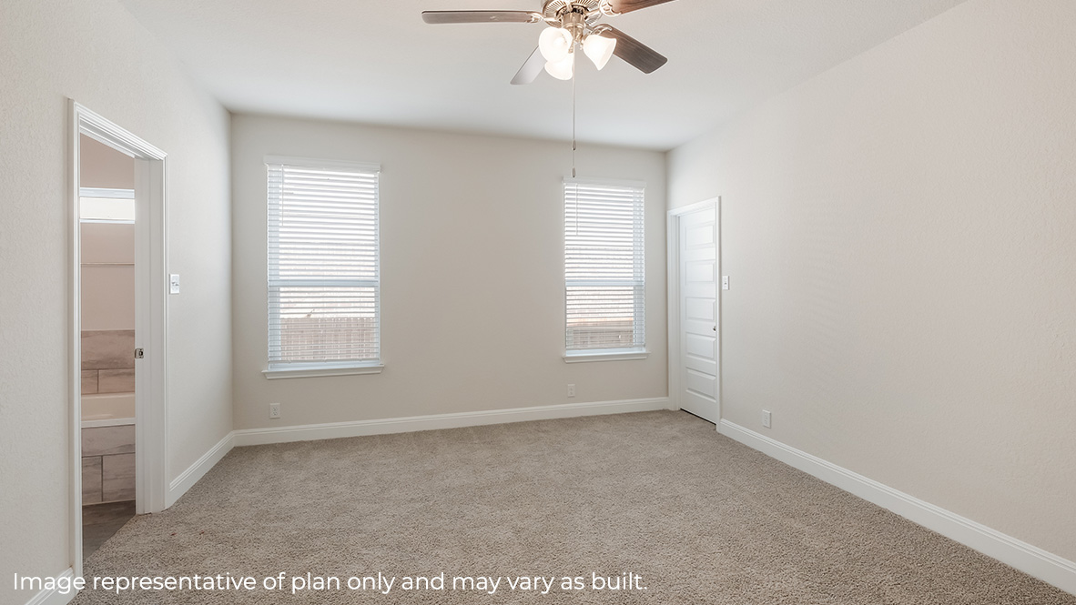 main bedroom suite with large windows, ceiling fan, carpet and ensuite bathroom