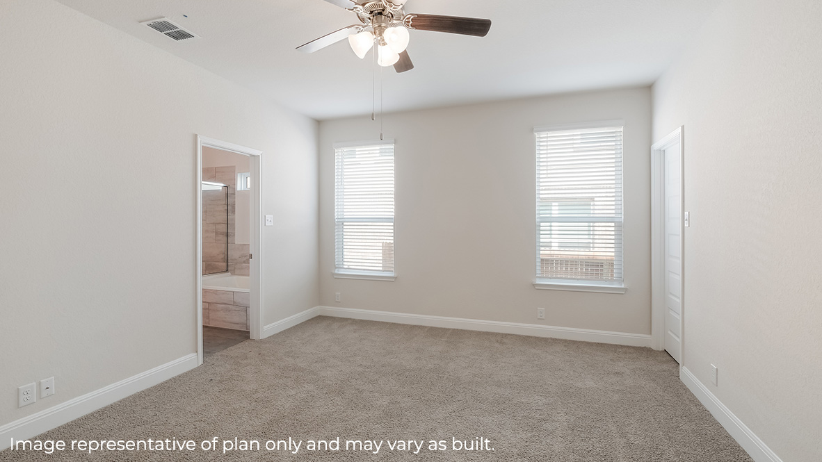 main bedroom suite with large windows, ceiling fan, carpet and ensuite bathroom