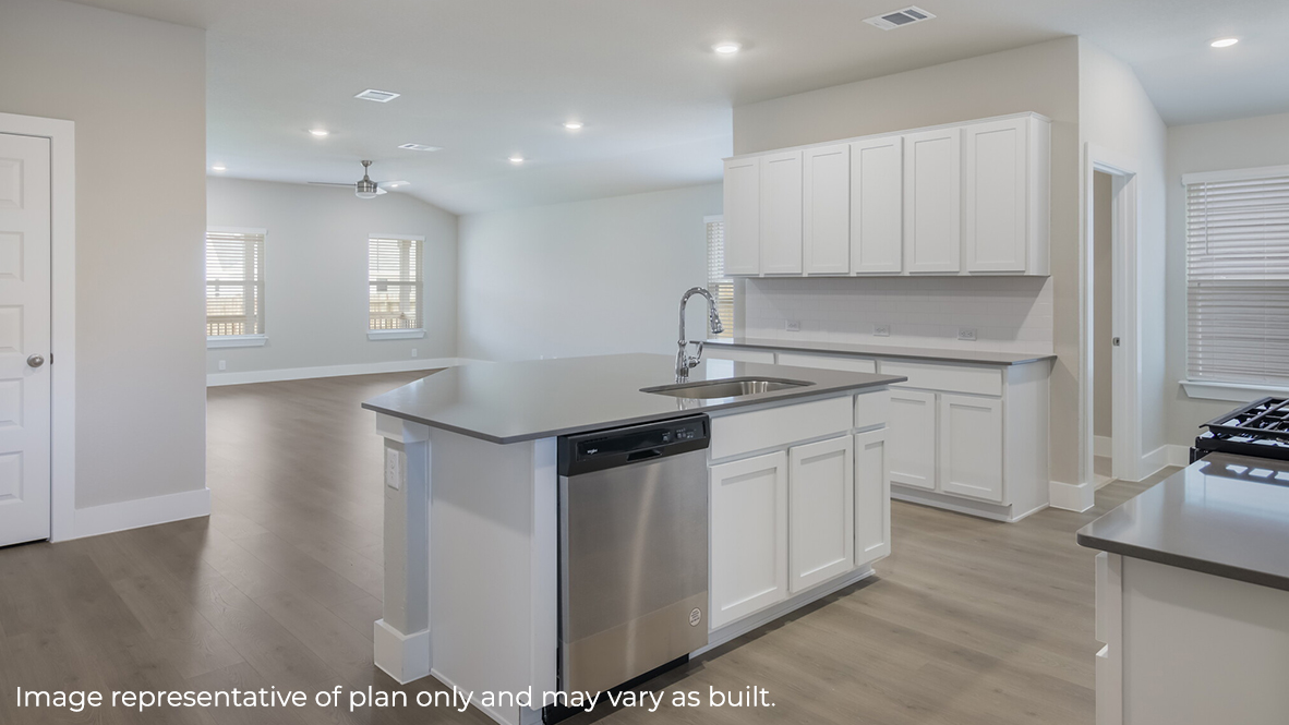 open concept kitchen flowing into living room with hard surface flooring throughout.