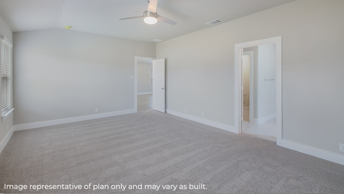 Spacious primary bedroom with quality carpet and ensuite bathroom.