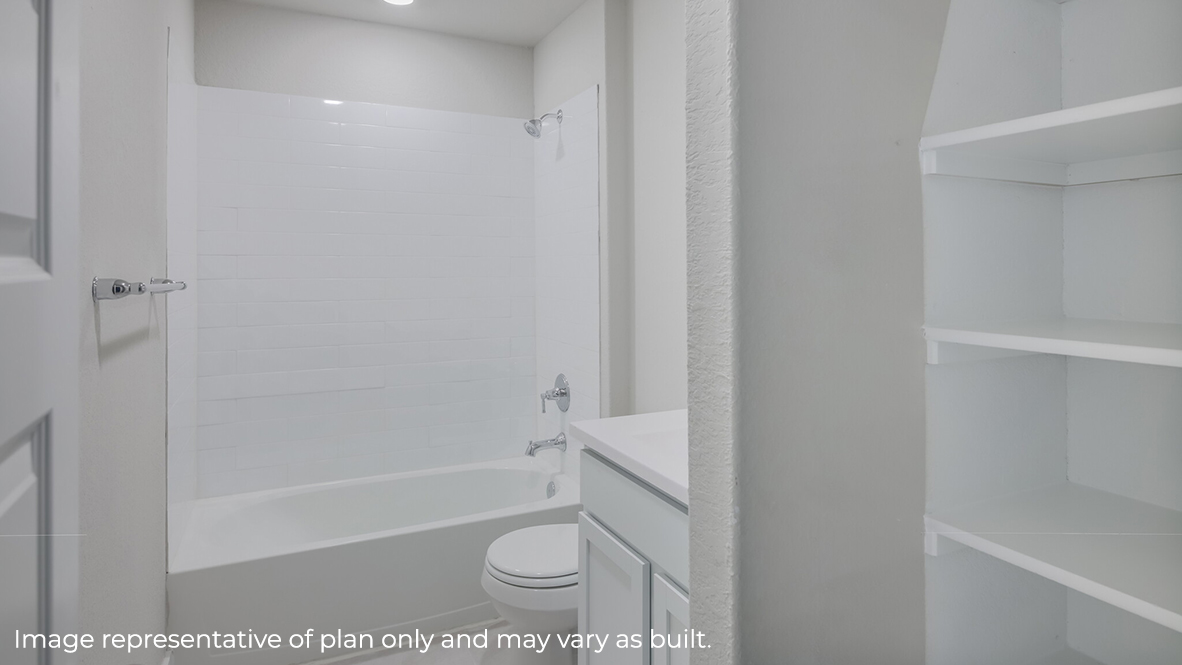 Second full bathroom with combined bathtub and shower, toilet, and single vanity sink.