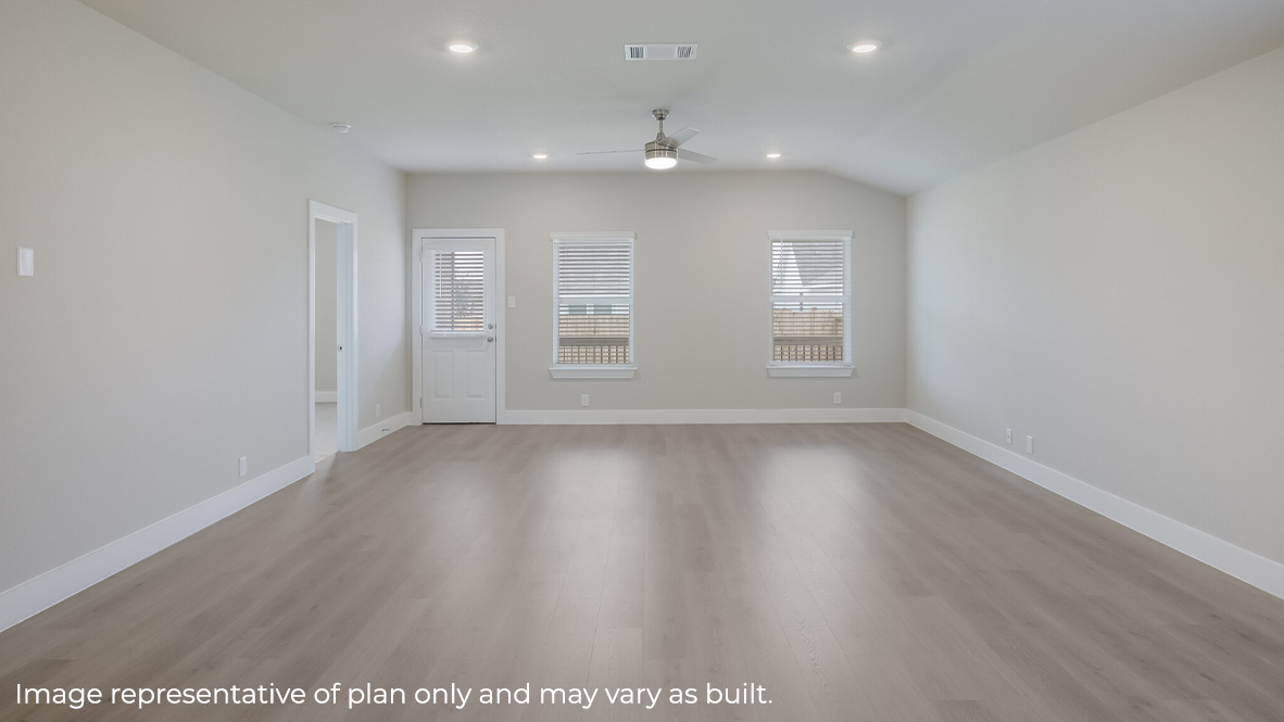 open concept dining area and living room with hard surface flooring, large windows and back door leading to covered patio (per plan.)