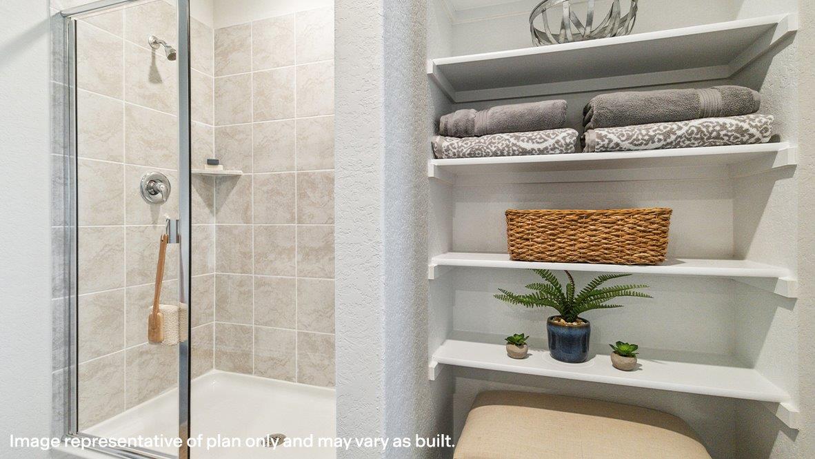 Primary bathroom with walk-in shower and closet.